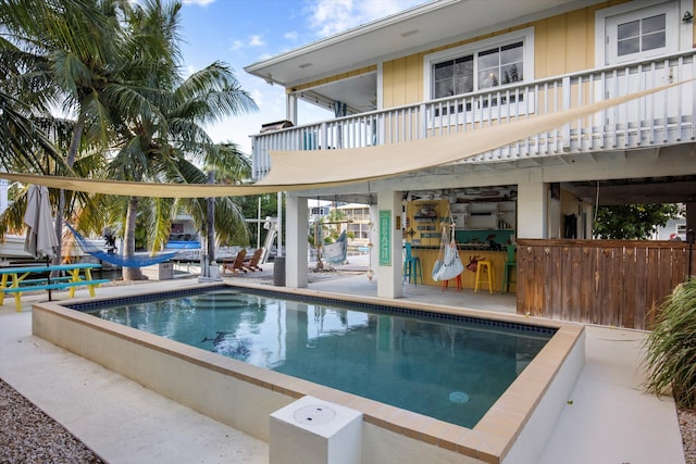 view of swimming pool featuring a patio area