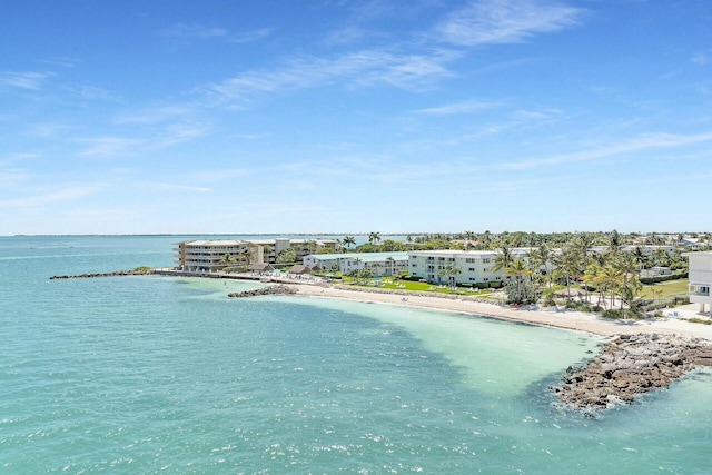 bird's eye view with a beach view and a water view