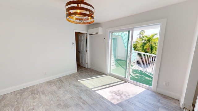 interior space featuring a wall unit AC and light hardwood / wood-style floors