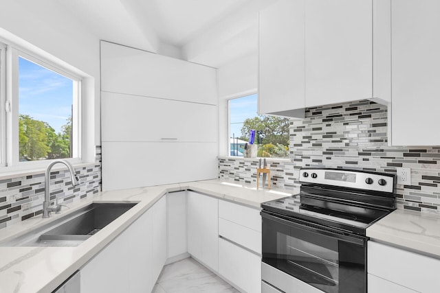 21 Lakeview Dr, Key Largo, FL 33037 - kitchen with stainless steel electric range, a sink, modern cabinets, and white cabinetry