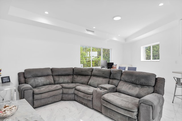 21 Lakeview Dr, Key Largo, FL 33037 - living room featuring light marble finish floors, a tray ceiling, and recessed lighting