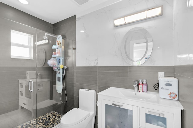 21 Lakeview Dr, Key Largo, FL 33037 - bathroom with tile walls, a shower stall, vanity, and toilet