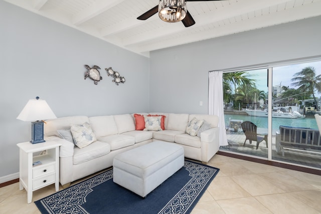 living room featuring wood ceiling, ceiling fan, beam ceiling, a water view, and tile patterned floors