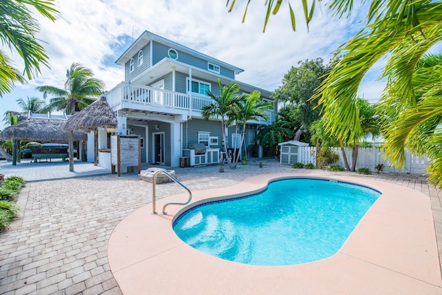 view of swimming pool with a gazebo and a patio area