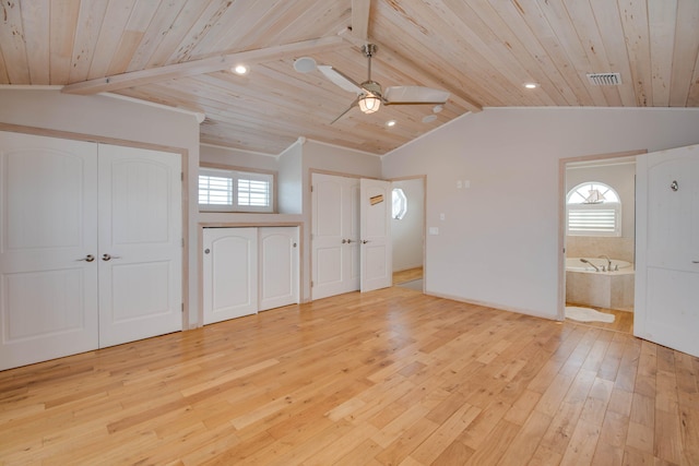 interior space with vaulted ceiling with beams, wooden ceiling, and light hardwood / wood-style floors