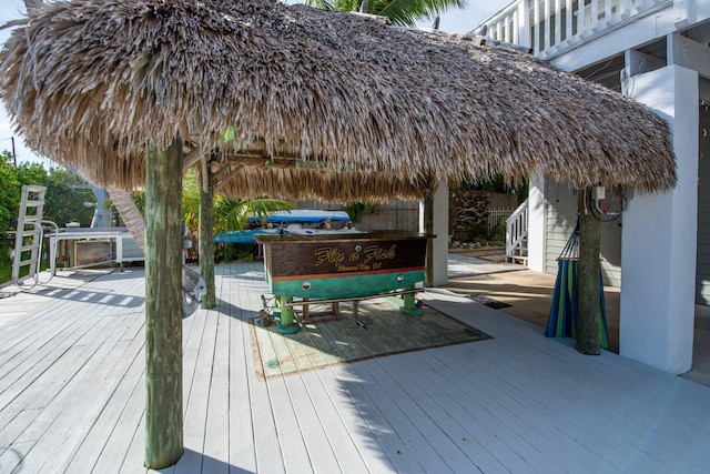 wooden terrace featuring a gazebo