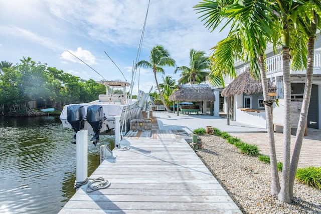 dock area featuring a gazebo and a water view