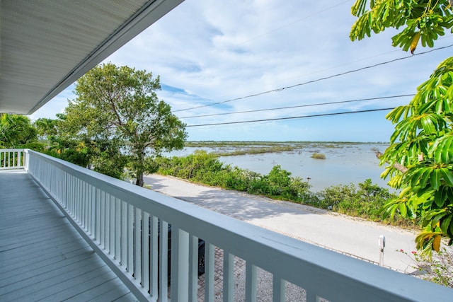 balcony featuring a water view