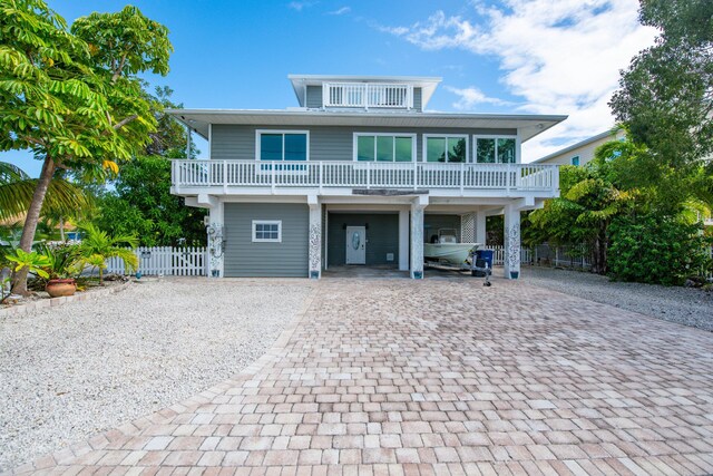 beach home featuring a carport and a balcony