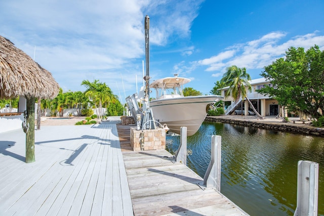 view of dock featuring a pool and a water view