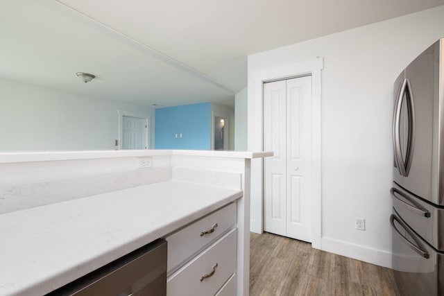 bathroom featuring vanity and hardwood / wood-style flooring