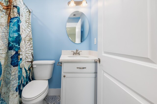 bathroom with vanity and toilet