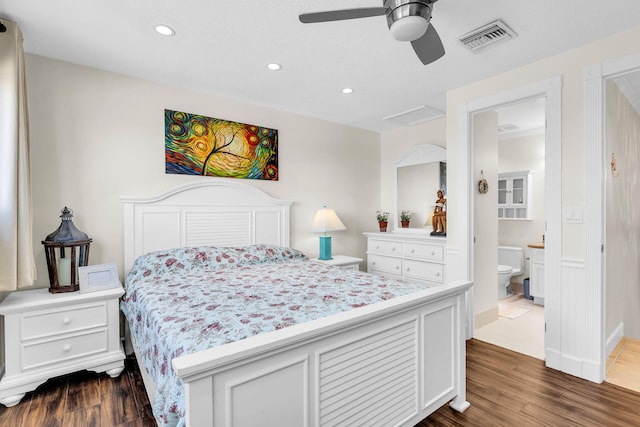 bedroom with ceiling fan, connected bathroom, and dark hardwood / wood-style floors