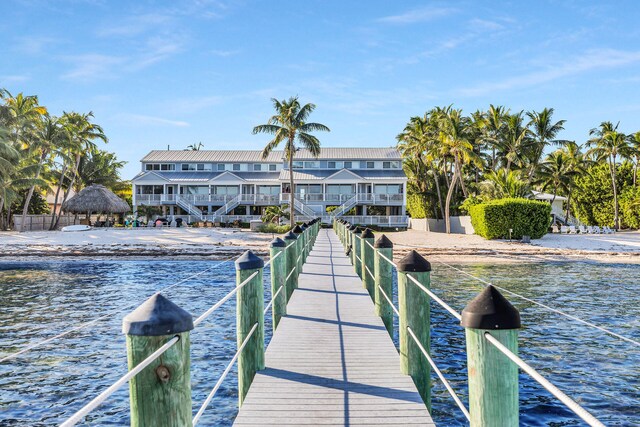 view of dock featuring a water view and a gazebo