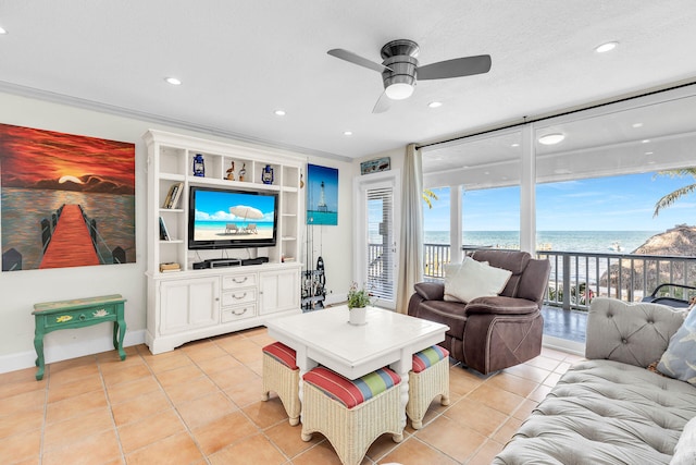 living room featuring ornamental molding, light tile patterned floors, ceiling fan, floor to ceiling windows, and a textured ceiling