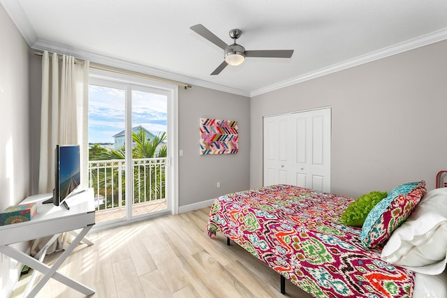 108 N Bounty Ln, Key Largo, FL 33037 - bedroom with ceiling fan, baseboards, ornamental molding, access to outside, and light wood-style flooring
