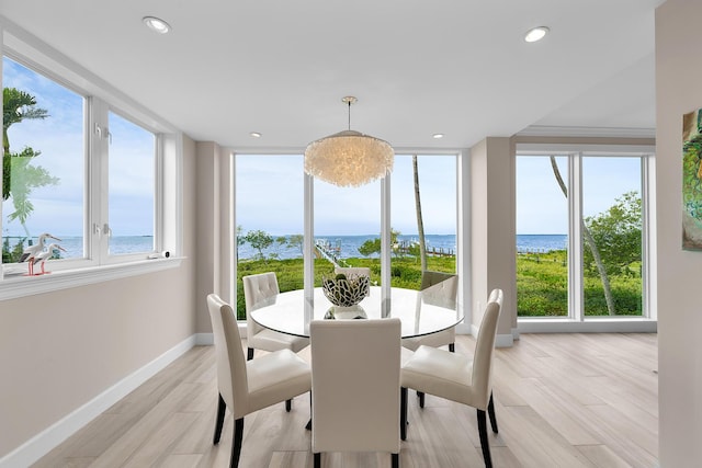 108 N Bounty Ln, Key Largo, FL 33037 - dining area with a water view, baseboards, recessed lighting, and light wood-style floors