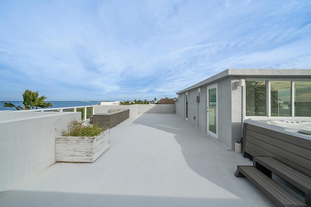 view of patio featuring a water view