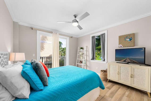 bedroom with multiple windows, crown molding, access to exterior, and light hardwood / wood-style floors