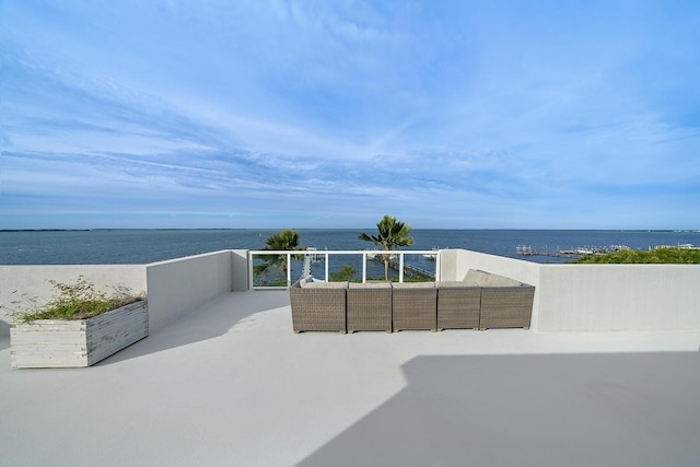 view of patio featuring outdoor lounge area and a water view