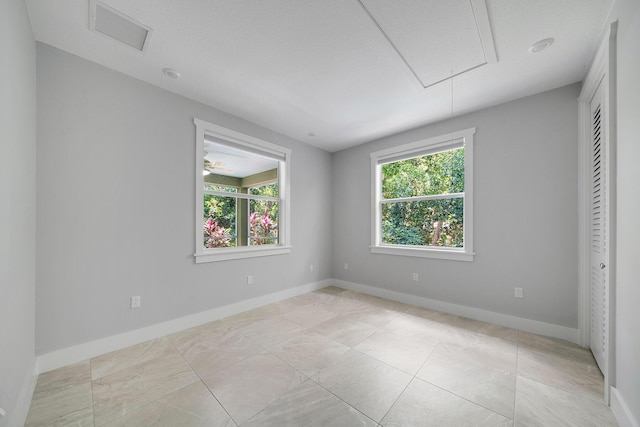 spare room featuring a wealth of natural light