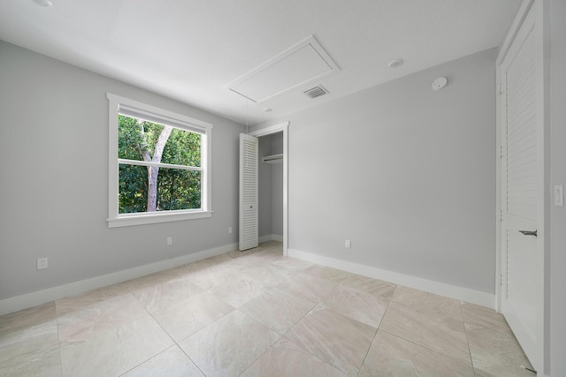 unfurnished bedroom with a closet