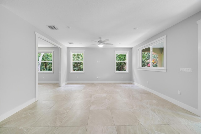 unfurnished room featuring ceiling fan