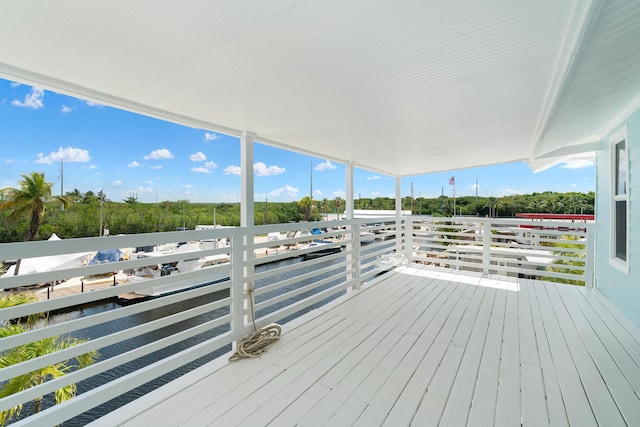 415 Big Pine Rd, Key Largo, FL 33037 - wooden deck featuring view of scattered trees