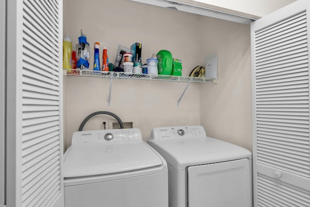 laundry area featuring washing machine and clothes dryer