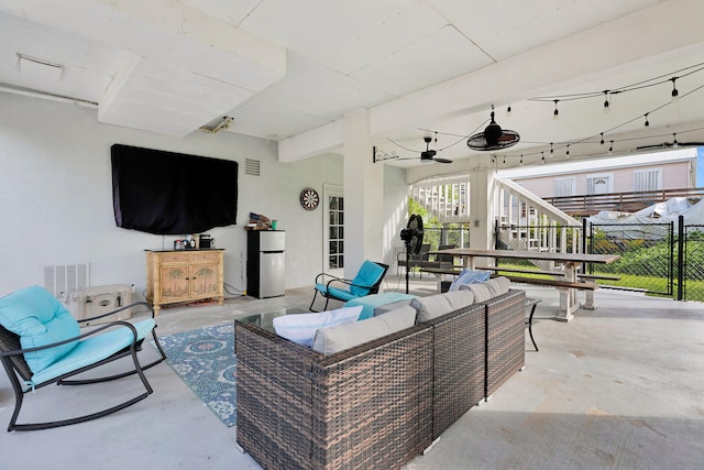 view of patio featuring an outdoor living space and ceiling fan