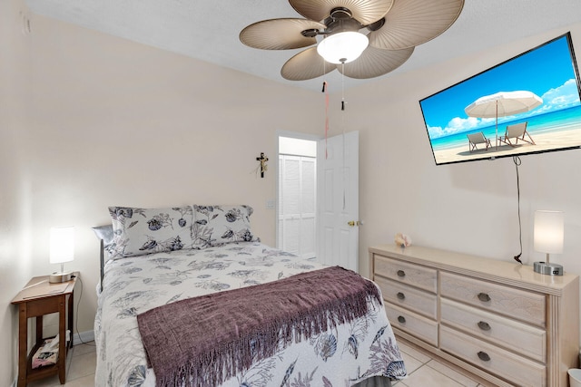 bedroom featuring light tile patterned flooring and ceiling fan