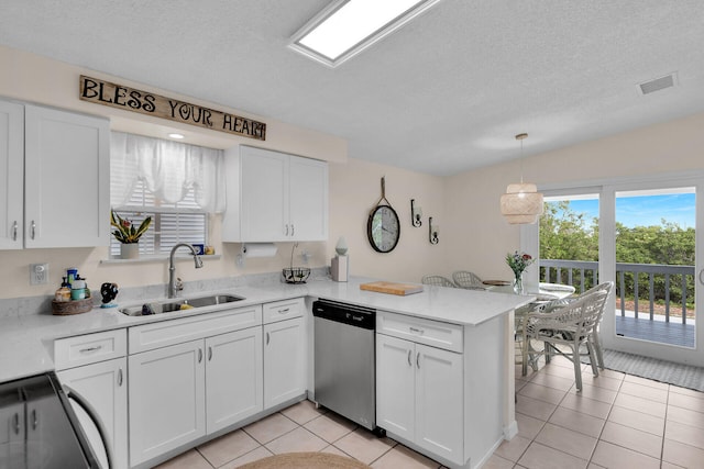 kitchen featuring decorative light fixtures, white cabinetry, dishwasher, sink, and kitchen peninsula