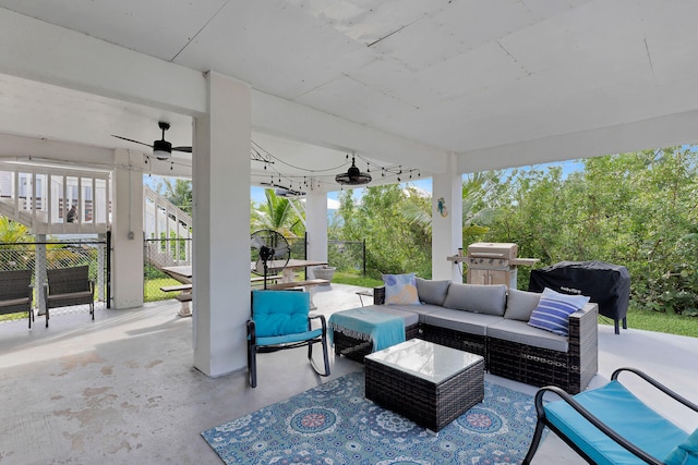 view of patio / terrace with ceiling fan, an outdoor living space, and a grill