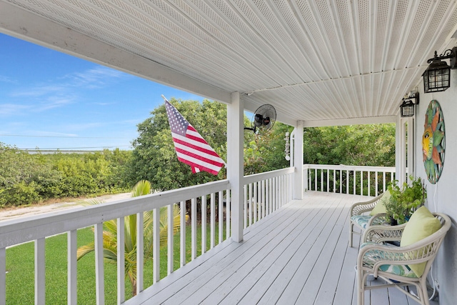 wooden deck with a yard