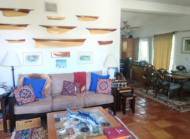 living area featuring visible vents, ceiling fan, and tile patterned flooring