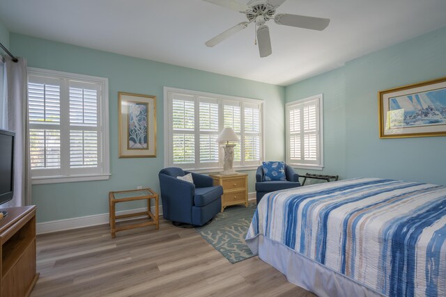 bedroom featuring ceiling fan and light hardwood / wood-style floors