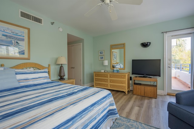 bedroom featuring light hardwood / wood-style flooring, access to outside, and ceiling fan