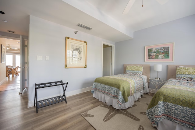 bedroom featuring hardwood / wood-style floors and ceiling fan