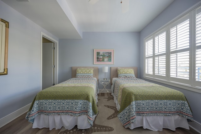 bedroom featuring hardwood / wood-style floors and ceiling fan