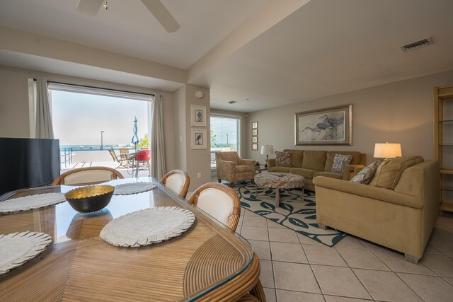 dining space featuring light tile patterned floors and ceiling fan