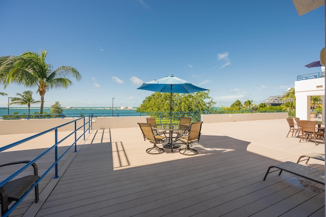 wooden deck with a water view