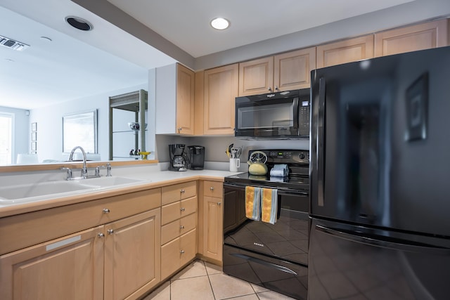 kitchen featuring light tile patterned floors, black appliances, sink, and light brown cabinets