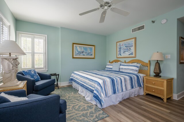 bedroom with wood-type flooring and ceiling fan