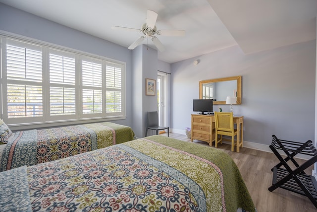 bedroom with ceiling fan and light hardwood / wood-style flooring