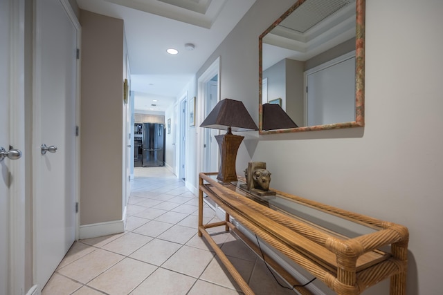 corridor featuring light tile patterned floors