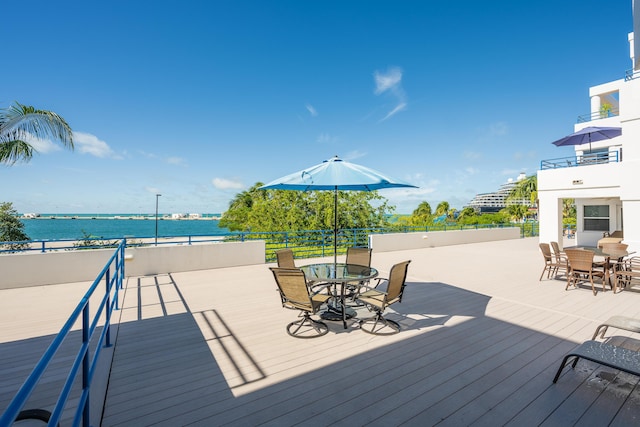 wooden deck featuring a water view