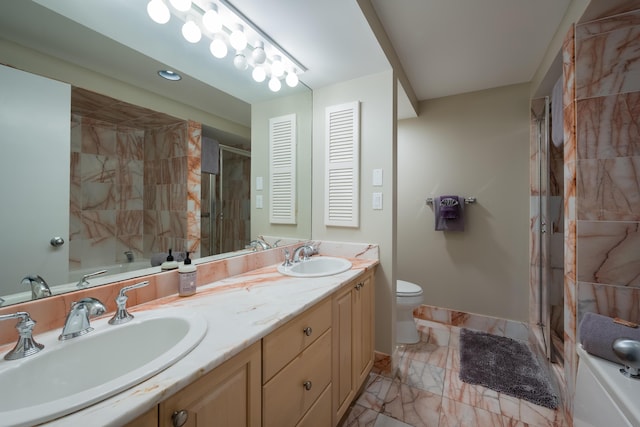 bathroom with vanity, toilet, and walk in shower