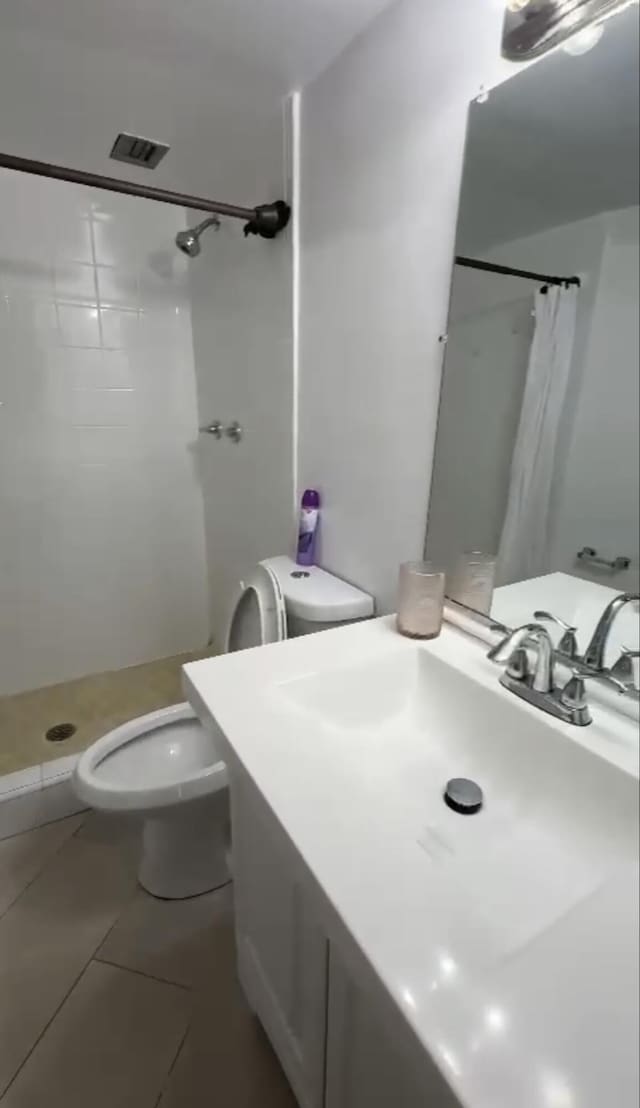 3312 Northside Dr Unit 607, Key West, FL 33040 - bathroom with a stall shower, vanity, and tile patterned floors