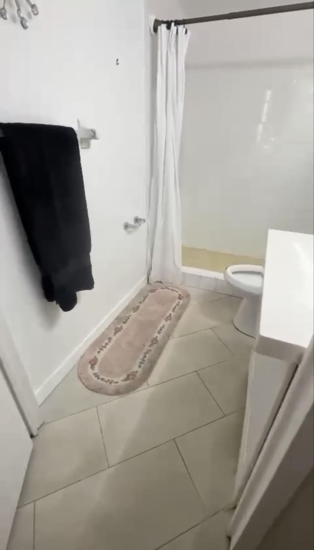 3312 Northside Dr Unit 607, Key West, FL 33040 - full bath featuring tile patterned flooring, a shower stall, and vanity