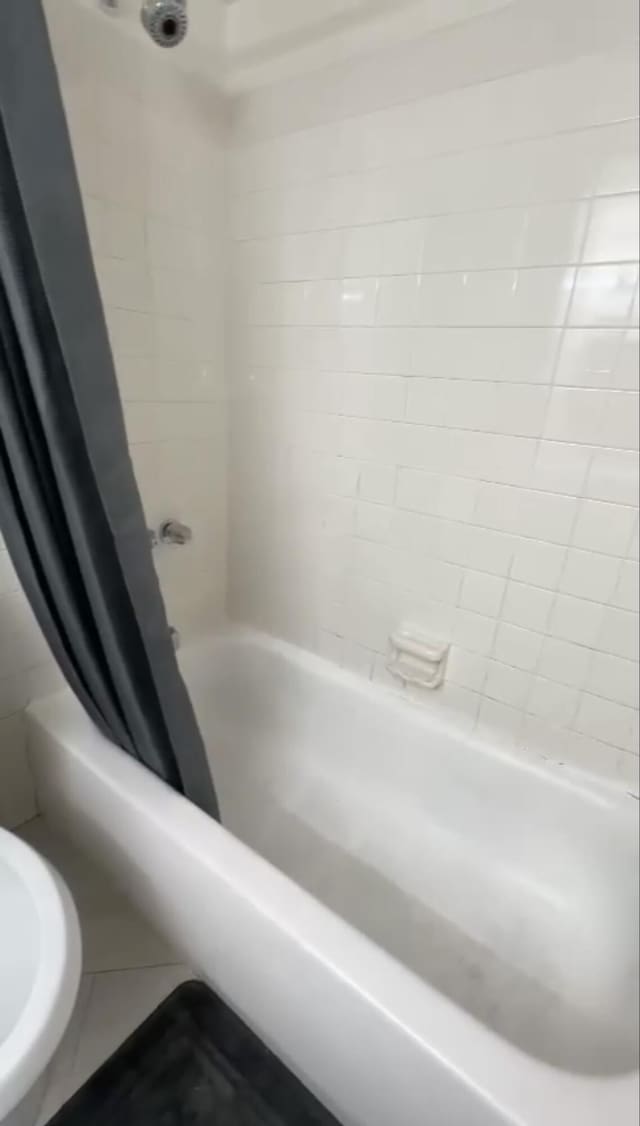3312 Northside Dr Unit 607, Key West, FL 33040 - full bathroom featuring shower / tub combo and tile patterned floors